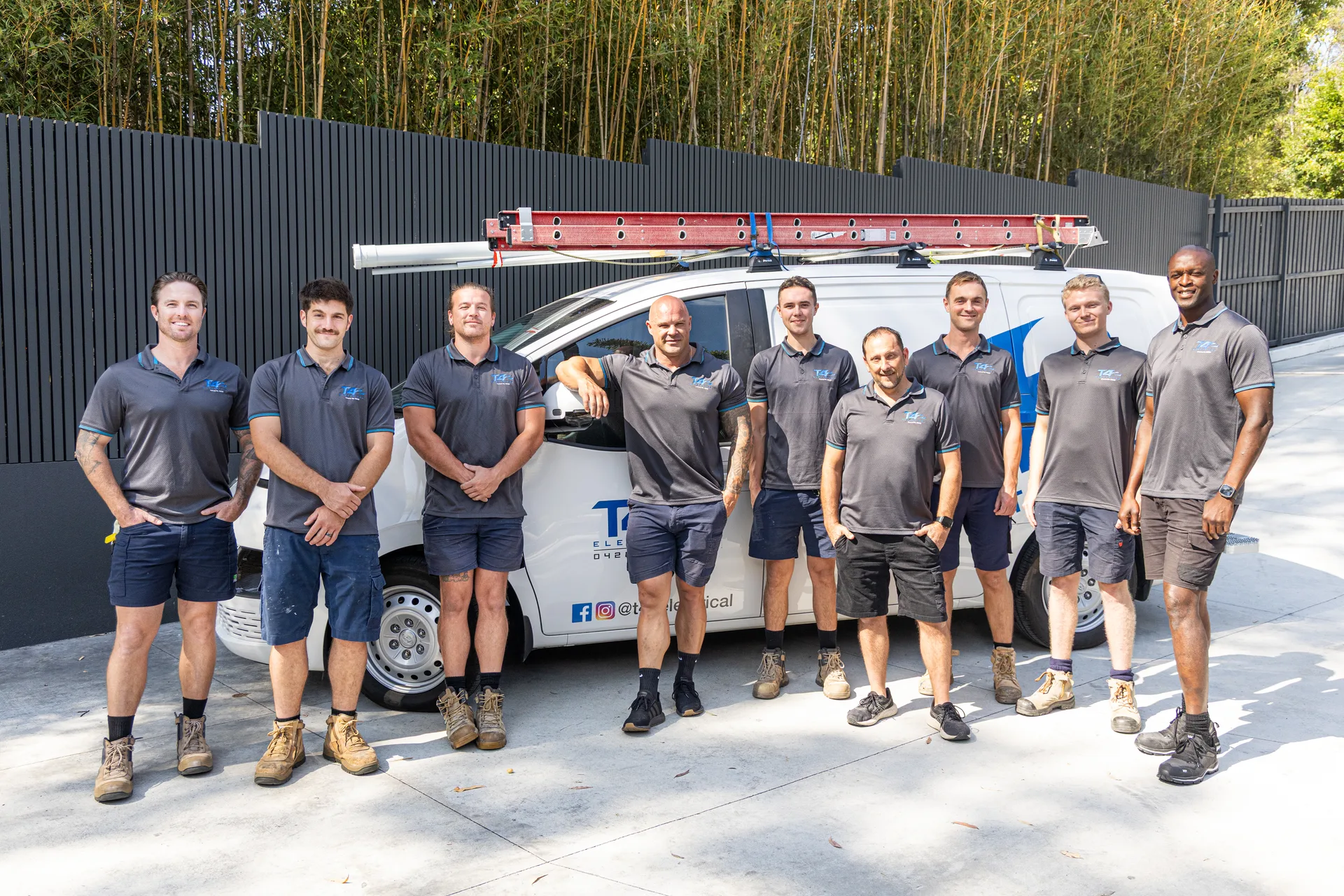 The Family Electrician Miami team with a service van